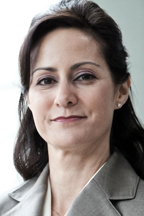 Confident businesswoman in professional attire, representing leadership and corporate success.