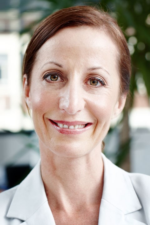 Confident woman smiling, professional headshot for business or corporate profile.