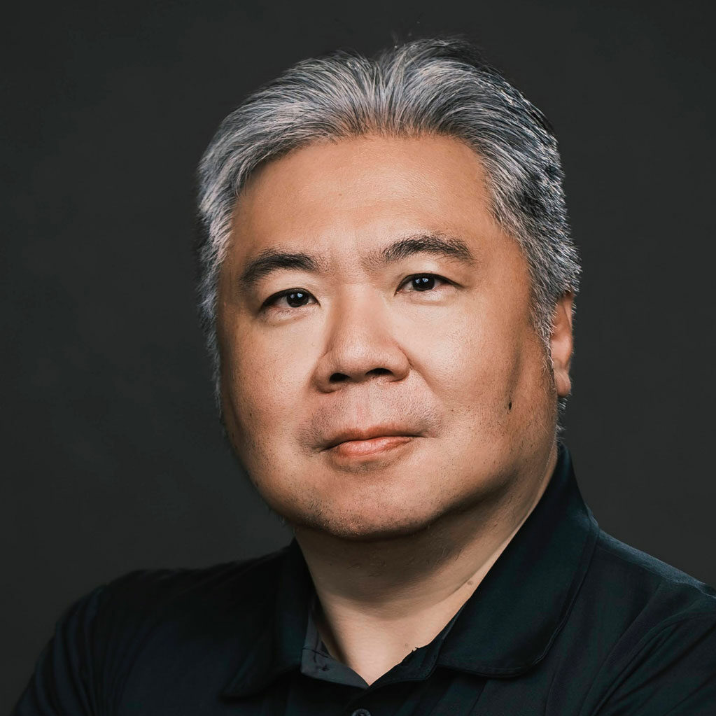 Asian man professional portrait, confident business leader, corporate headshot for SEO content.