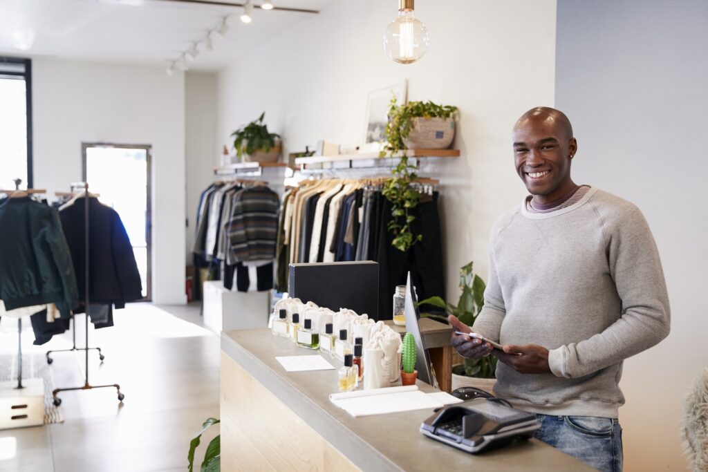 Bright retail store interior showcasing clothing and accessories for sale.