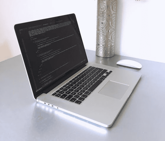 Code programming on a laptop screen, work from home, cybersecurity, software development.