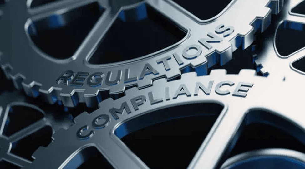 ISO compliance gears representing regulations and standards in cybersecurity and data protection.