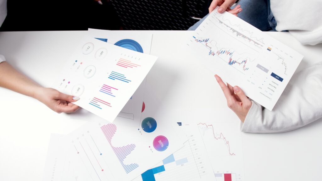 Data analysis and market research using financial graphs and charts for business insights.