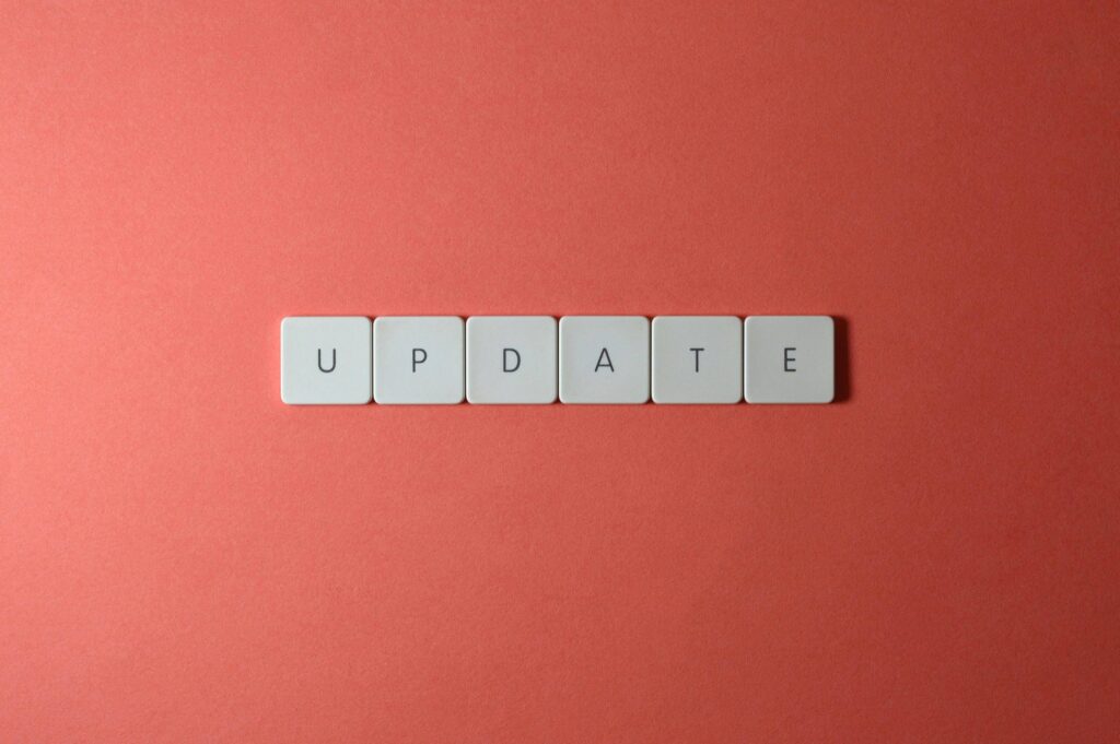Update announcement on creative keyboard tiles on a pink background.