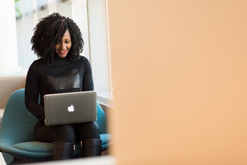 Efficient professional woman working on a laptop at concentrus.com.