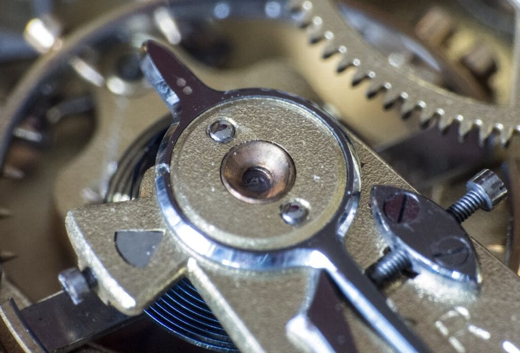 Precision watch movement gears and components for high-end horology.
