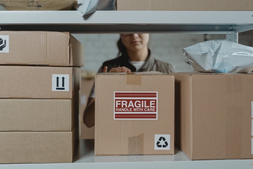 Fragile gift boxes in warehouse, shipping and handling, logistics and packaging concept.