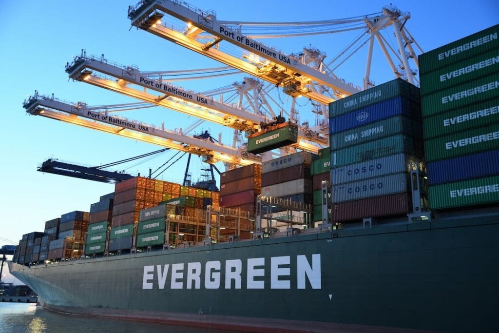 Container ship loaded at Port of Baltimore with shipping containers and cranes, logistics, transportation, ocean freight.