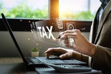 Person entering tax IDs on laptop screen for SuiteTax compliance.
