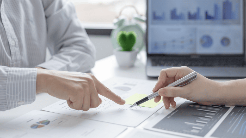 Business professionals reviewing NetSuite financial data and strategy.