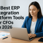 Businesswoman using a laptop with ERP tools for CFOs, modern office setting.