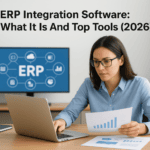 Woman working on laptop with ERP software on screen, analyzing data.