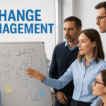 Business team discussing change management strategies around a whiteboard.