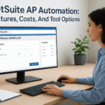 Woman using NetSuite AP automation software on desktop monitor.
