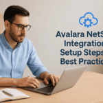 Man working on a laptop with Avalara NetSuite Integration text on the wall.