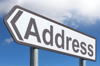 Street address sign pointing to address form customization in NetSuite.