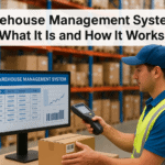 Warehouse worker using handheld device to monitor inventory with system display.
