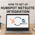 Laptop displaying HubSpot and NetSuite integration diagram with workspace accessories.